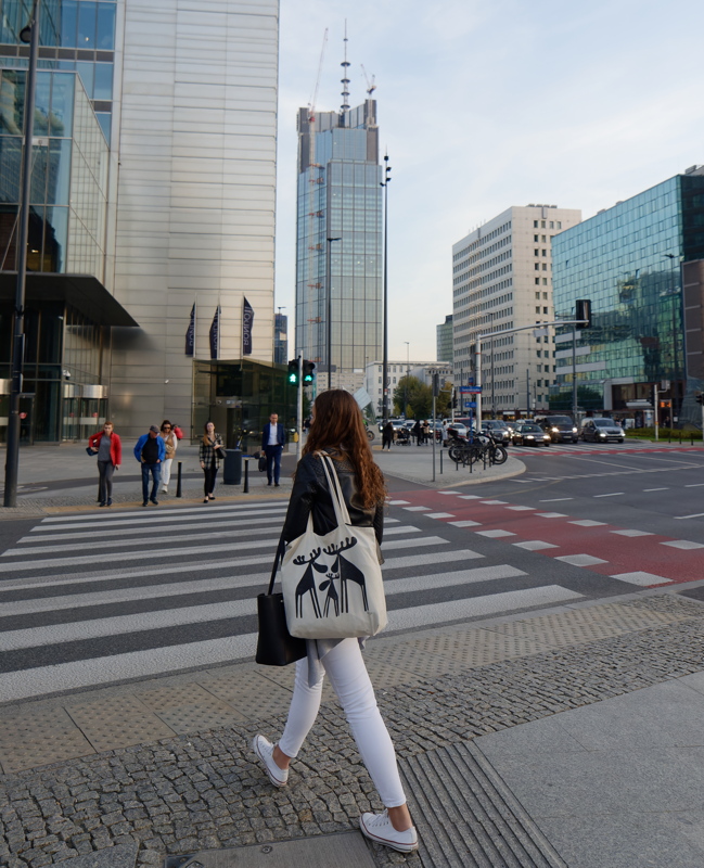 5 - A pedestrian crossing a city street in a modern urban environment from Warsaw